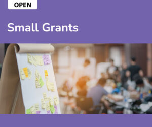 Small Grants RFP banner. Image of a large meeting pad with nnotes and post-its. 