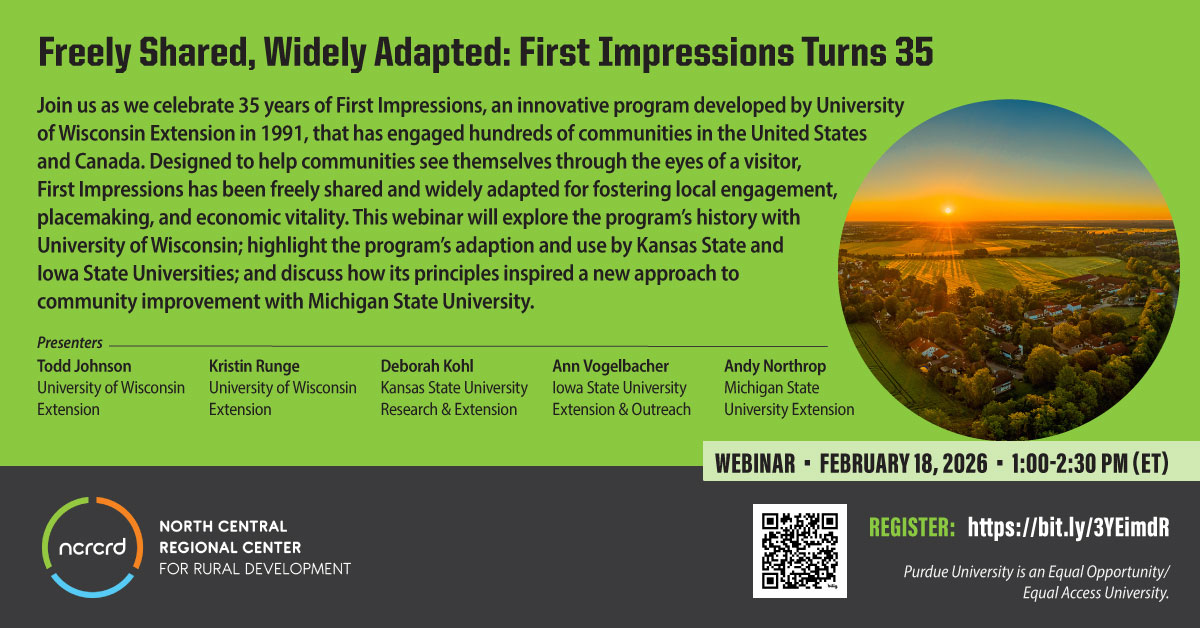 Aerial photo of a sunrise over a rural community of homes and farms.