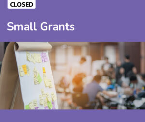 Small Grants RFP banner. Image of a large meeting pad with nnotes and post-its.