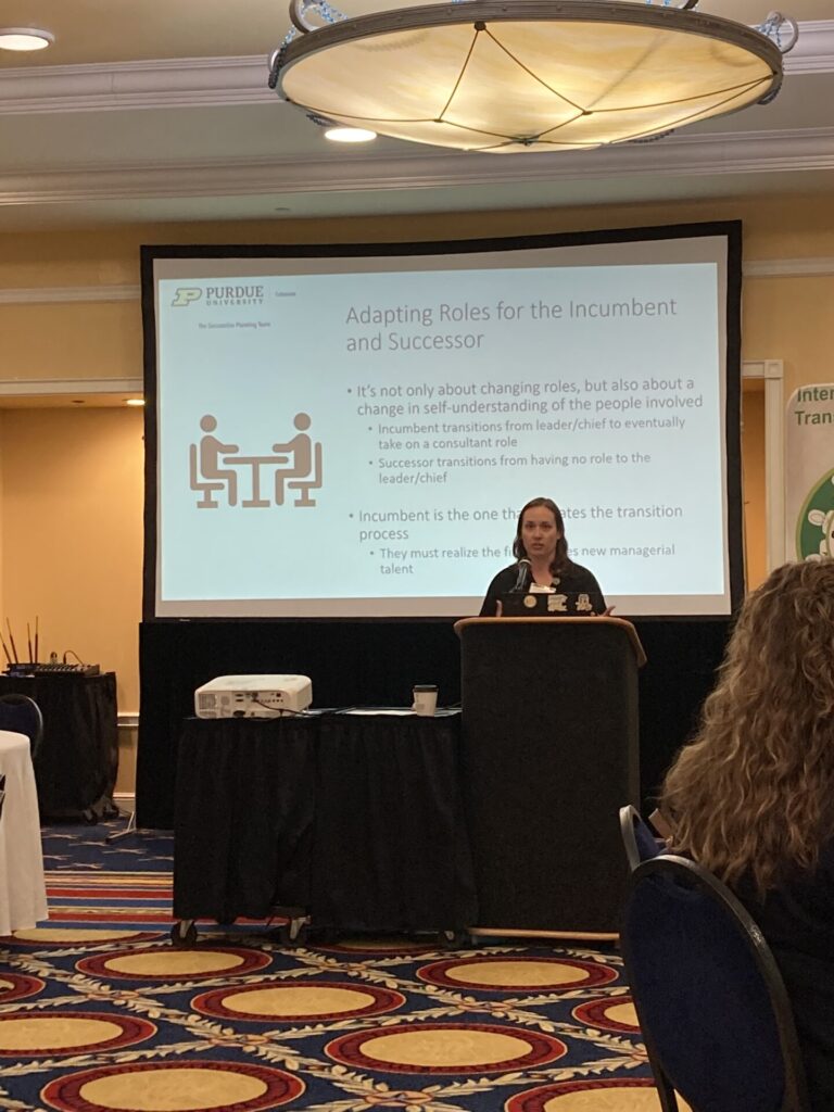 woman presenting at a conference
