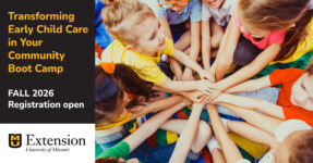 children sitting in a circle with hand outstretched toward the center